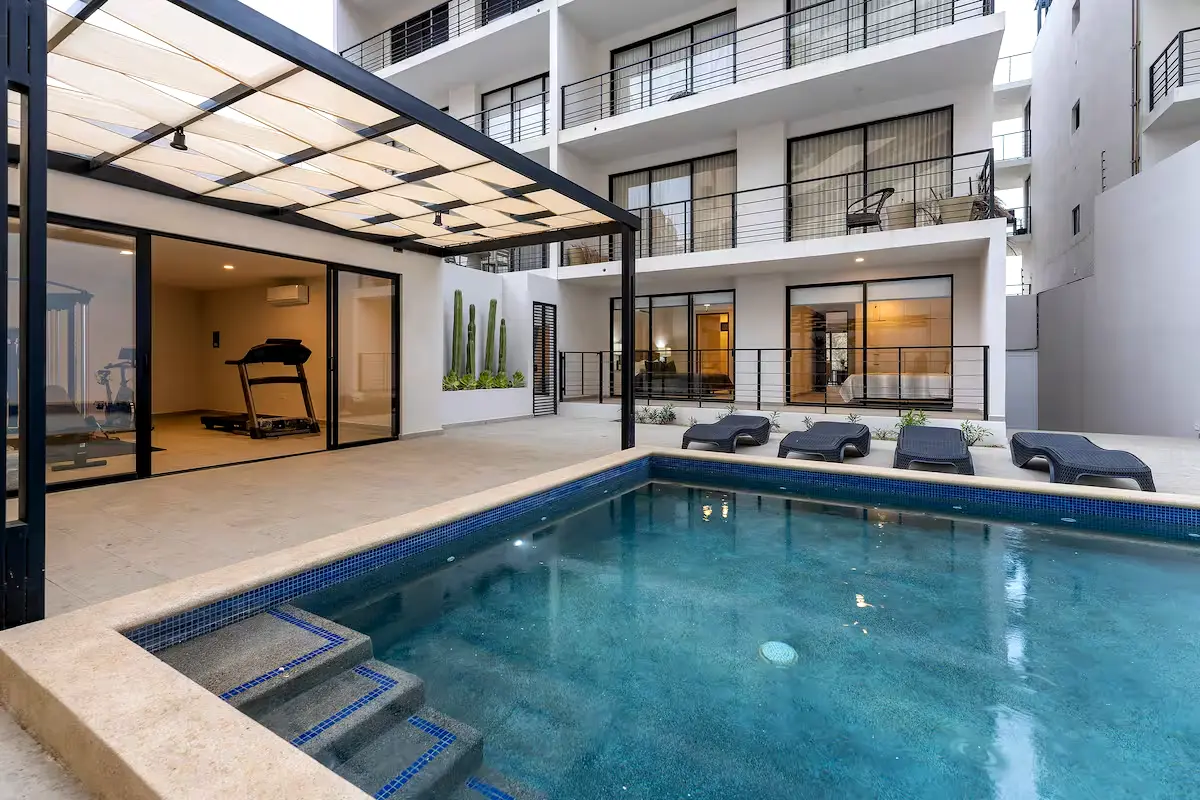 Modern 4 br accommodation with pool and gym.