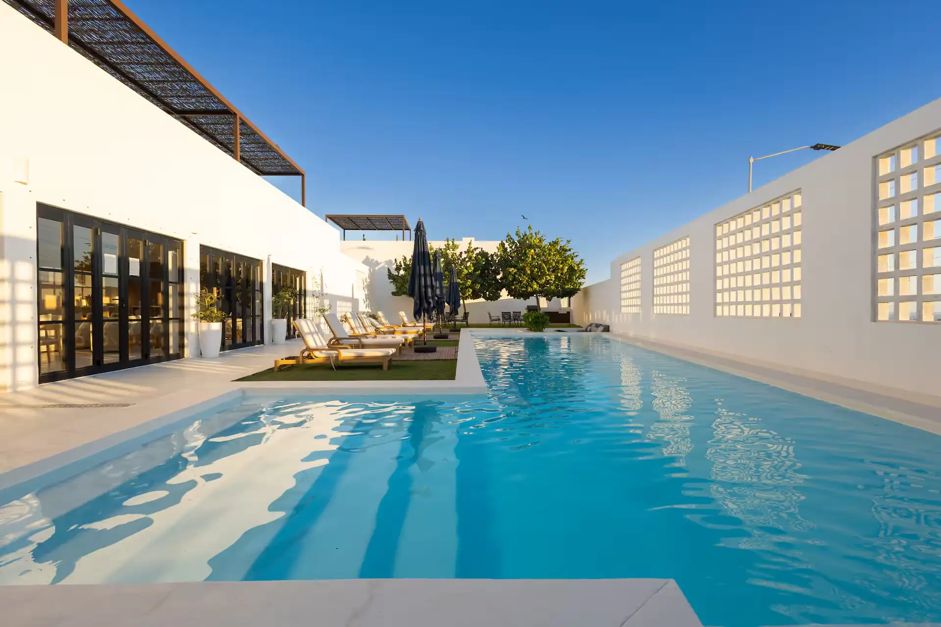 Bright 2-bedroom Mediterranean-style retreat just 7 minutes from downtown Cabo. Features a rooftop with bay views and BBQ, plus 24/7 concierge service. Only 35 minutes from the airport.